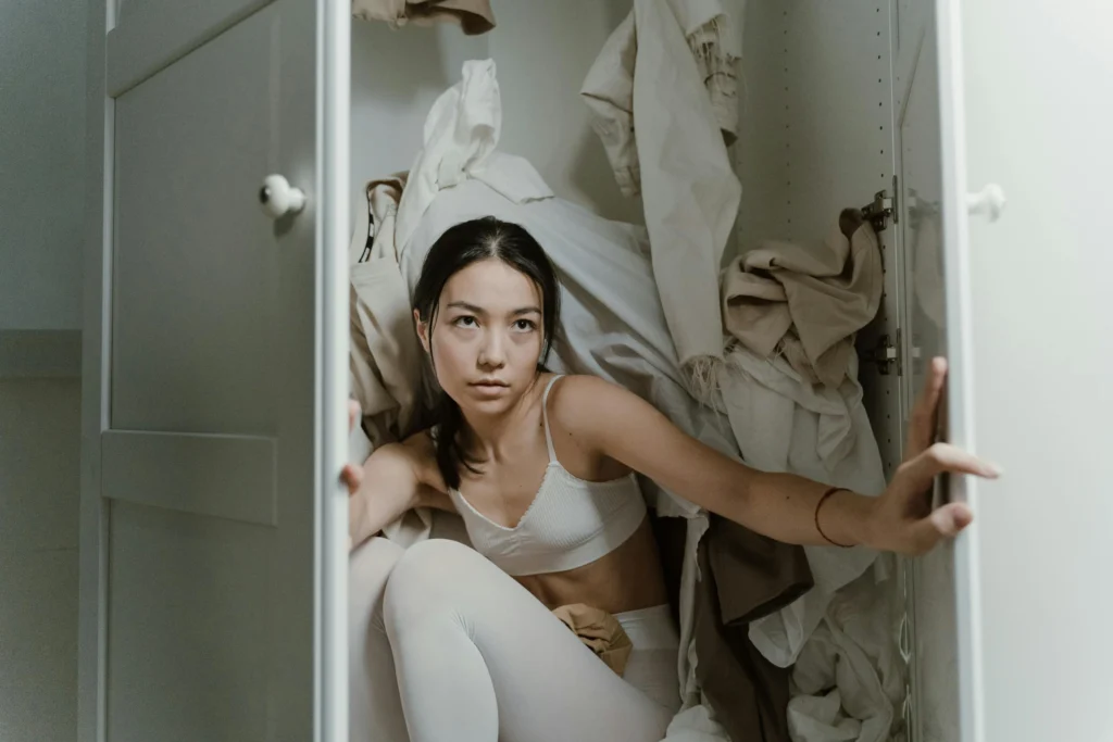 A lady is frustrated with how poor closet design made her room messy, overcrowded, and not functional.